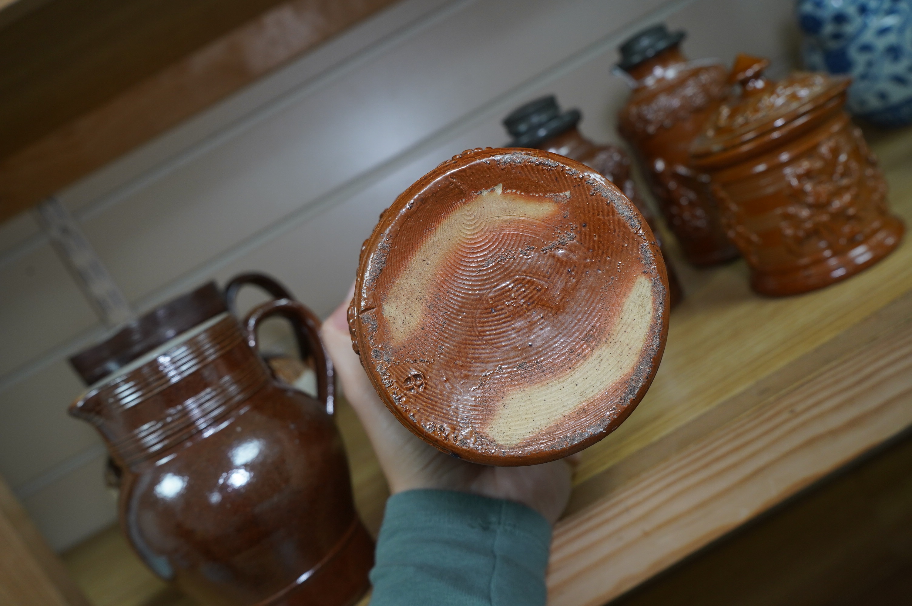 Four 19th century Derbyshire lead glazed stoneware jars and a stoneware jug and another, tallest 21cm (6). Condition - poor to fair